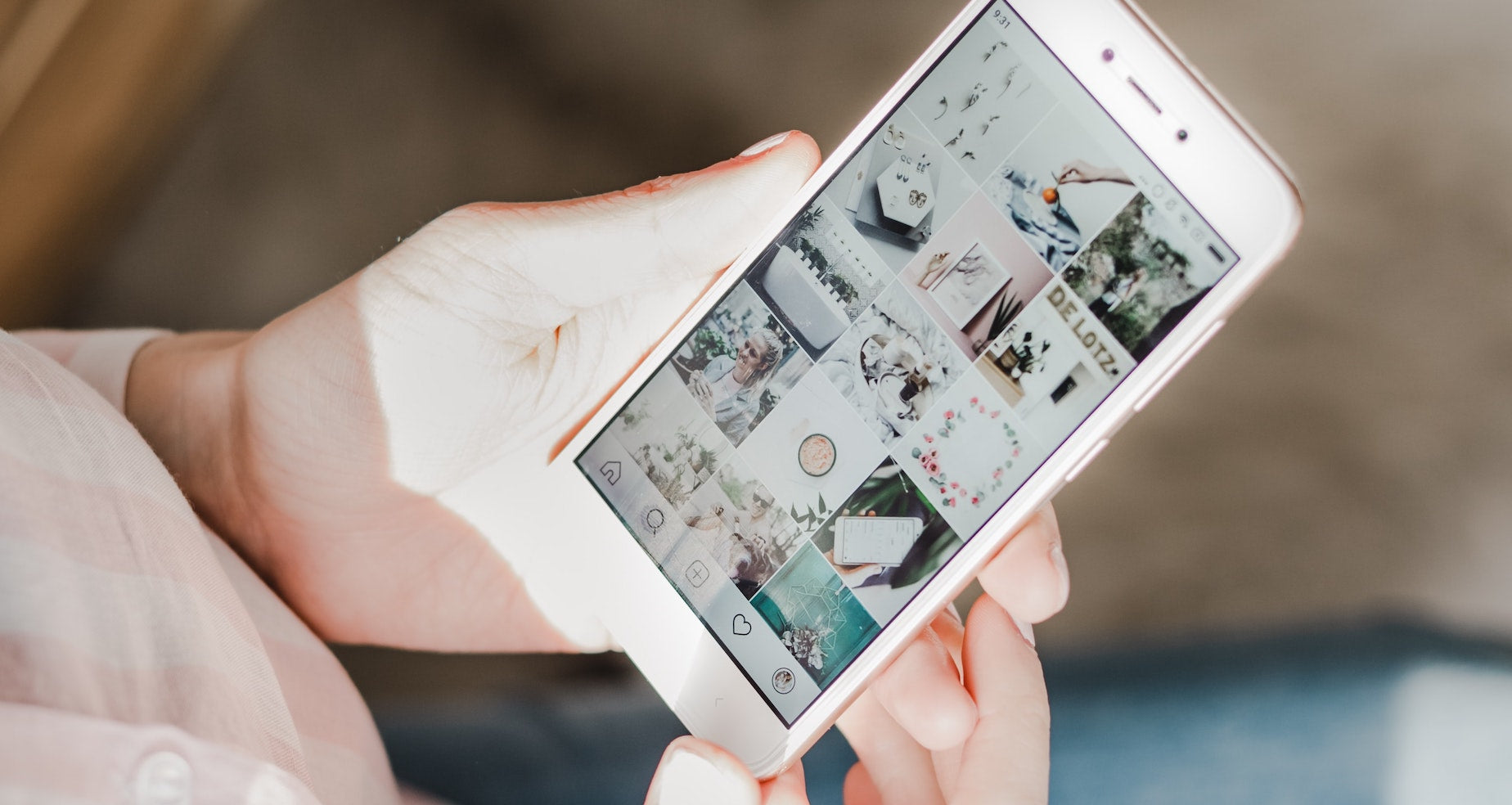 A person looks at an Instagram feed on their phone